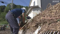 大雨被害の各地 厳しい暑さの中 住民たちが片づけに追われる