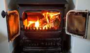 Prof Chris Whitty's damning report unveils how energy-saving wood burners are 'deadly'