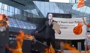 German climate strike targets financial sector as Deutsche Bank logo set alight in protest