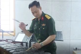 Nam NSND mang hàm Đại tá, có bằng tiến sĩ, là Phó Hiệu trưởng trường quân đội