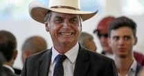 ''Pessoal ali, a maioria pago'', diz Bolsonaro sobre protestos