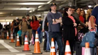 Shutdown sparks flight chaos as TSA lines spill into parking lots with 3-hour waits or longer