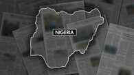 Gunmen kill at least 50 in attacks on village in Nigeria