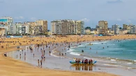 Beach town cracks down on half-naked tourists with hefty fines for inappropriate attire