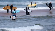'Large shark' kills man at Australian beach, with witness describing hearing screams of 'don't bite me!'