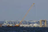 Crews prepare for removal of twisted steel from collapsed bridge