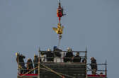 Notre Dame spire gets golden rooster weathervane, a symbol of a phoenix