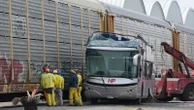 At least 10 dead, 41 injured, after train rams bus