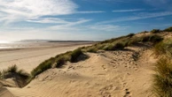 Man charged with sexual assault of woman sunbathing at popular beach