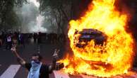 Pensioners and football fans clash with police in protest at austerity in Argentina