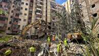 Anxious families line the pavement as dozens remain missing in the rubble after Beirut strike