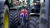 Environment secretary says 'sorry' to farmers over tax 'shock' - as noisy protest impacts speech