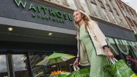 John Lewis blames budget tax hikes for deeper loss