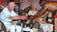 King sips ceremonial drink and is given pig carcass as he's welcomed to Samoa