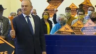 Sir Ed Davey takes down a blue wall... literally