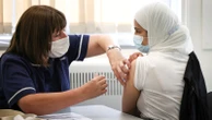 Vaccines will 'not be enough' and humanity must 'adapt' to COVID, expert warns