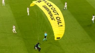 Climate protester parachutes on to pitch at Euro 2020 game