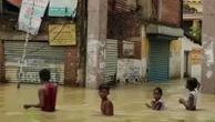 Wading waist-deep in West Bengal floods