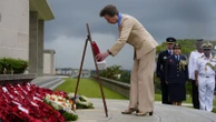 Princess Anne lays a wreath at memorial service in Singapore
