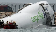 Cargo plane slides off runway in Hong Kong - reports say two dead