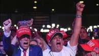 Trump supporters sense a win as they turn off the news for MAGA anthem