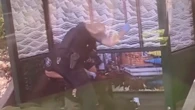 Police officers filmed beating man on ground with batons at a bus stop