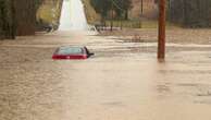 At least nine dead as severe rain, flooding and lows of -35C hit the US