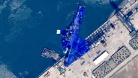 North Korea launches investigation into why new warship ended up on its side