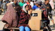Palestinians flock to Gaza aid centres despite concerns - as top judges call for sanctions on Israel