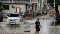 China floods: At least 30 killed in Beijing and 80,000 evacuated