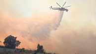 Firefighters tackle blazes as 'apocalyptic' wildfires break out across southeast Europe