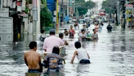 Tropical storm sweeps through the Philippines, leaving at least 25 dead and forcing thousands to evacuate 