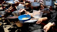 Aid is sitting idle in Gaza - where there is now widespread malnutrition