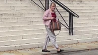 Former Conservative MP appears in court accused of having false passport