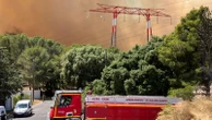 Wildfire 'at the gates' of Marseille and airport closed as people told to stay indoors