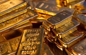 Після рекорду золото подешевшало через очікування зниження ставок ФРС