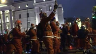 Skaters take over London streets wearing Santa outfits to pr…