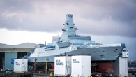 Kate names Royal Navy warship by smashing bottle of whisky against hull