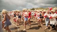 Almost 200 Marilyn Monroe lookalikes take the plunge for charity swim