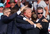 Trump shot in right ear at campaign rally, shooter dead