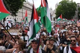 Eight arrested at pro-Palestine rally as thousands gather in over 30C heat