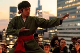 How is Karate Kid: Legends linked to Cobra Kai?