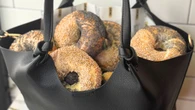 DKNY Partners With Zucker’s Bagels to Celebrate Their Signature Bag, the Paula Commuter Tote