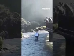 Tourist risks deadly fall... all for a cellphone