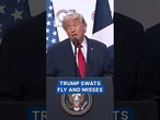 Trump swats a fly and misses