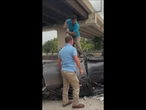 Heroic scenes on highway after car drives off overpass