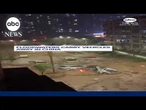 Floodwaters carry vehicles away in China