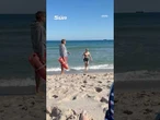 Moment shark appears seconds after a woman got out of the water in Florida
