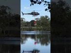 Shocking moment helicopter spins out of control and crashes into lake