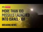 Explosions seen in night sky amid reports Iran has fired nearly 200 missiles at Israel